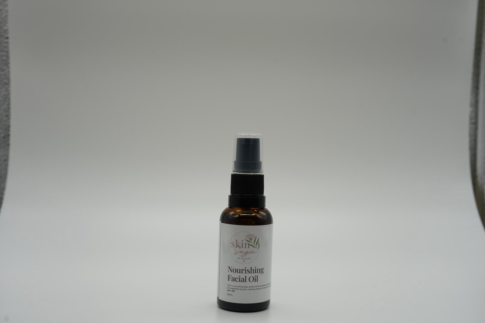 Skin Suga Nourishing Facial Oil in its authentic original packaging, photographed against a studio backdrop